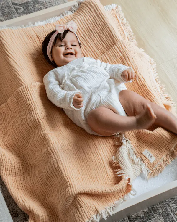 Little Fishies Gauze Receiving Blanket - Peach Fuzz | Sand Cloud - Image 2